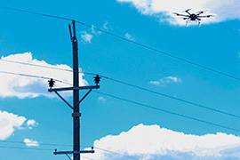 UAS flies over power lines